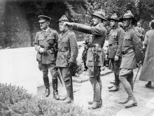 Leslie Averill (pointing) at the dedication ceremony for the New Zealand memorial at Le Quesnoy, France, 1923.